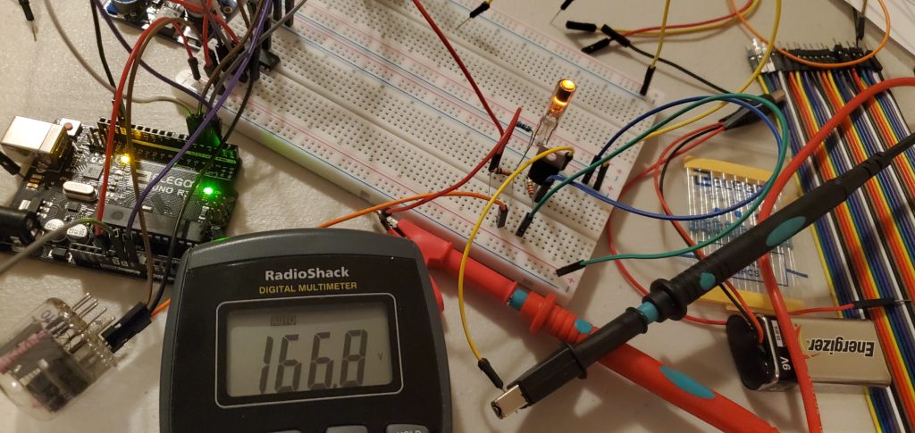 Here I am testing one of the dot indicators () that separate the hours from the minutes and the minutes from the seconds on the clock. You could see on the multimeter that the dot indicator is running at 166.8 volts. For comparison, wall outlets in North America run at 120 volts.