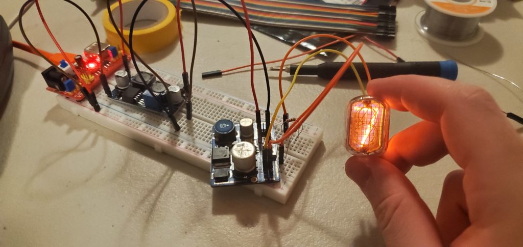 Initial testing of a nixie tube. I was learning how to power on the IN-12A nixie tube, which requires a high voltage (170V) to function!